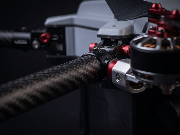 Close-up of drone arm with carbon fiber and motor hardware