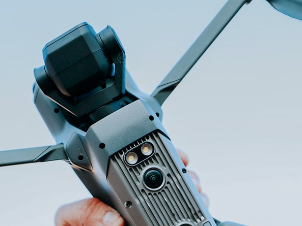 Compact drone underside showing sensors and airframe